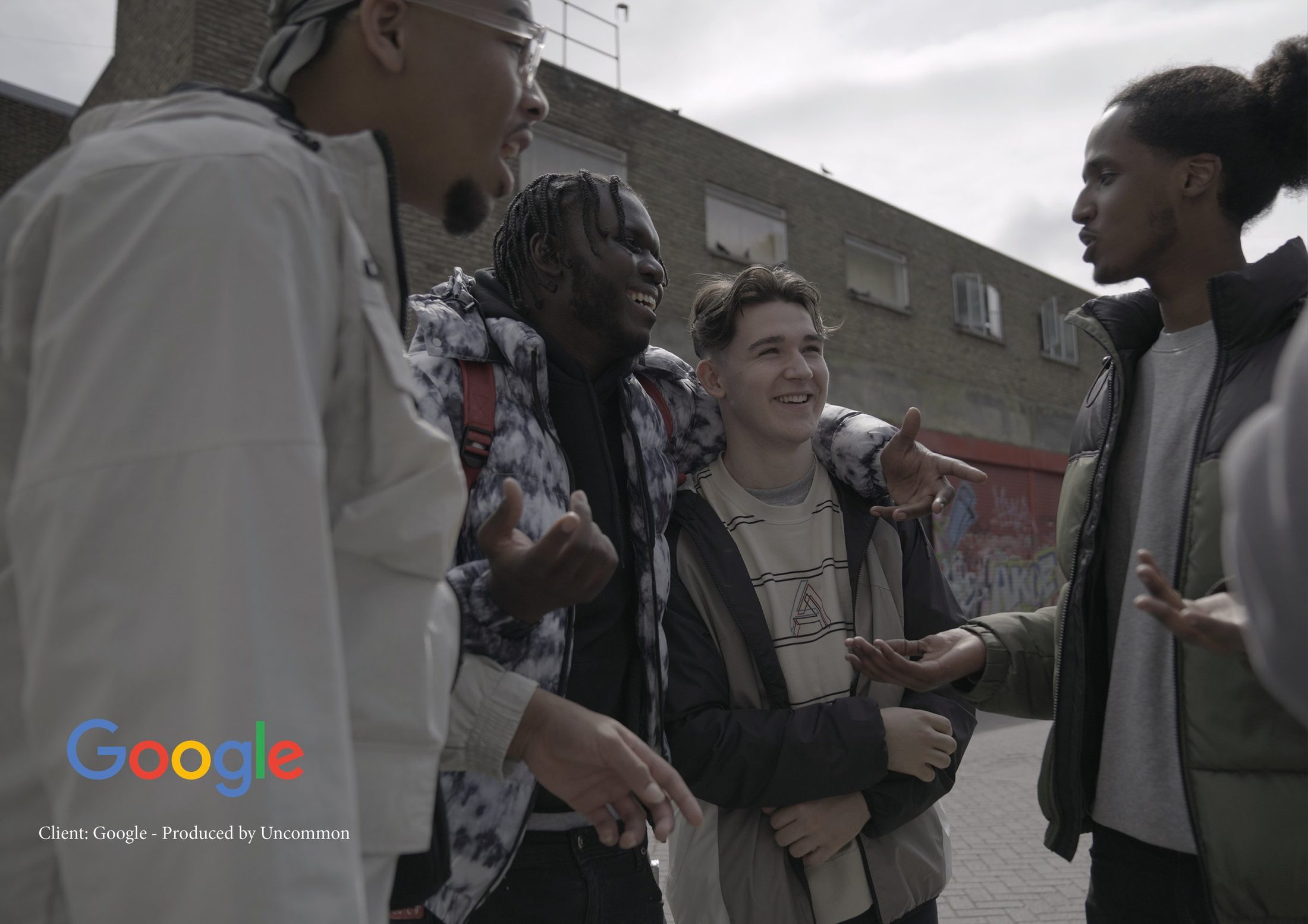 Young people talking on an estate, Google