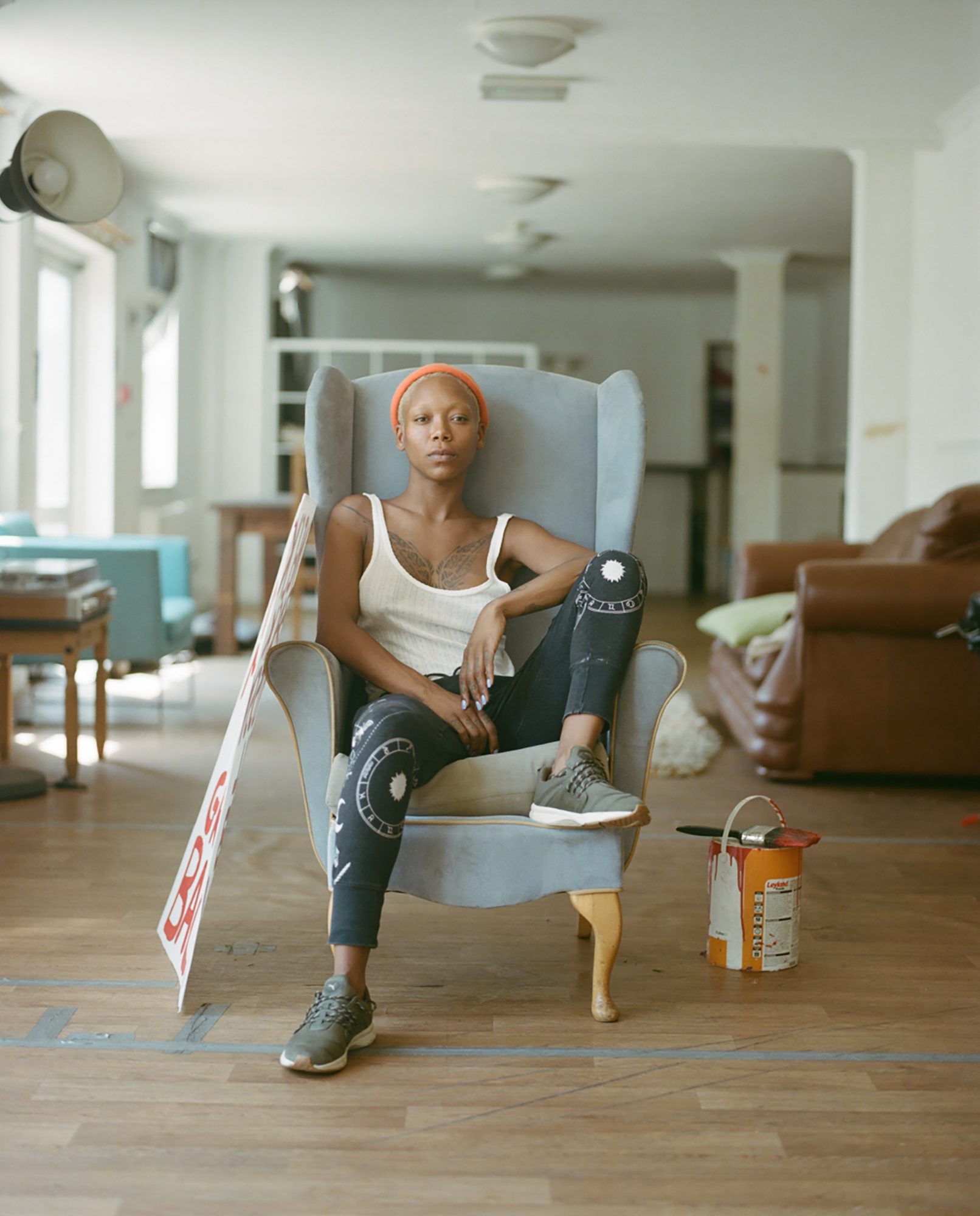 Property guardian seated in a wing-back chair