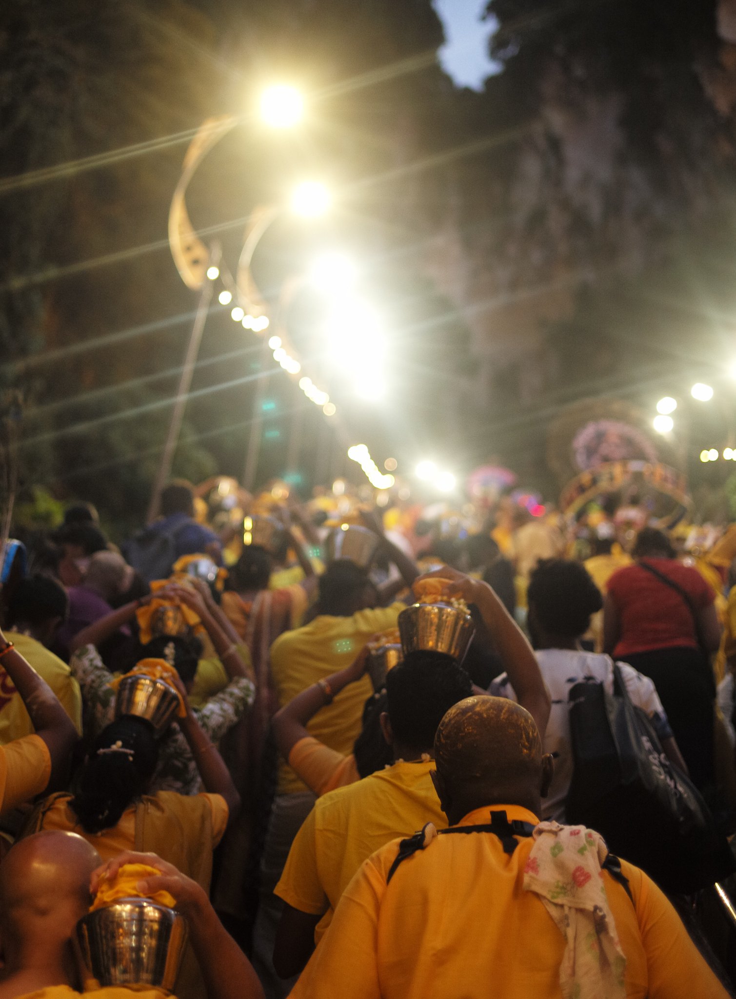 Devotees moving through the night, Thaipusam