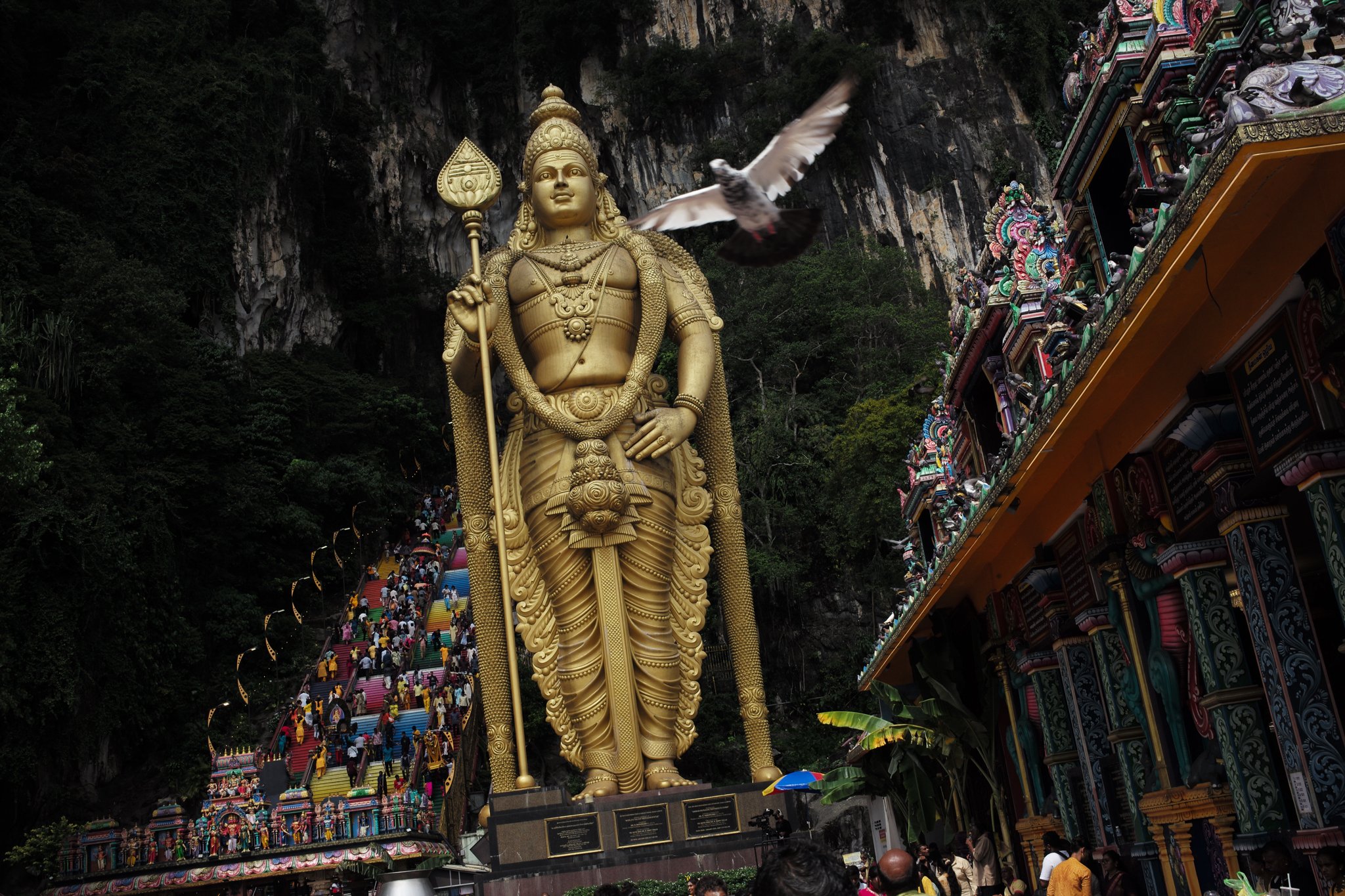 The golden Murugan statue above the Batu Caves stairs