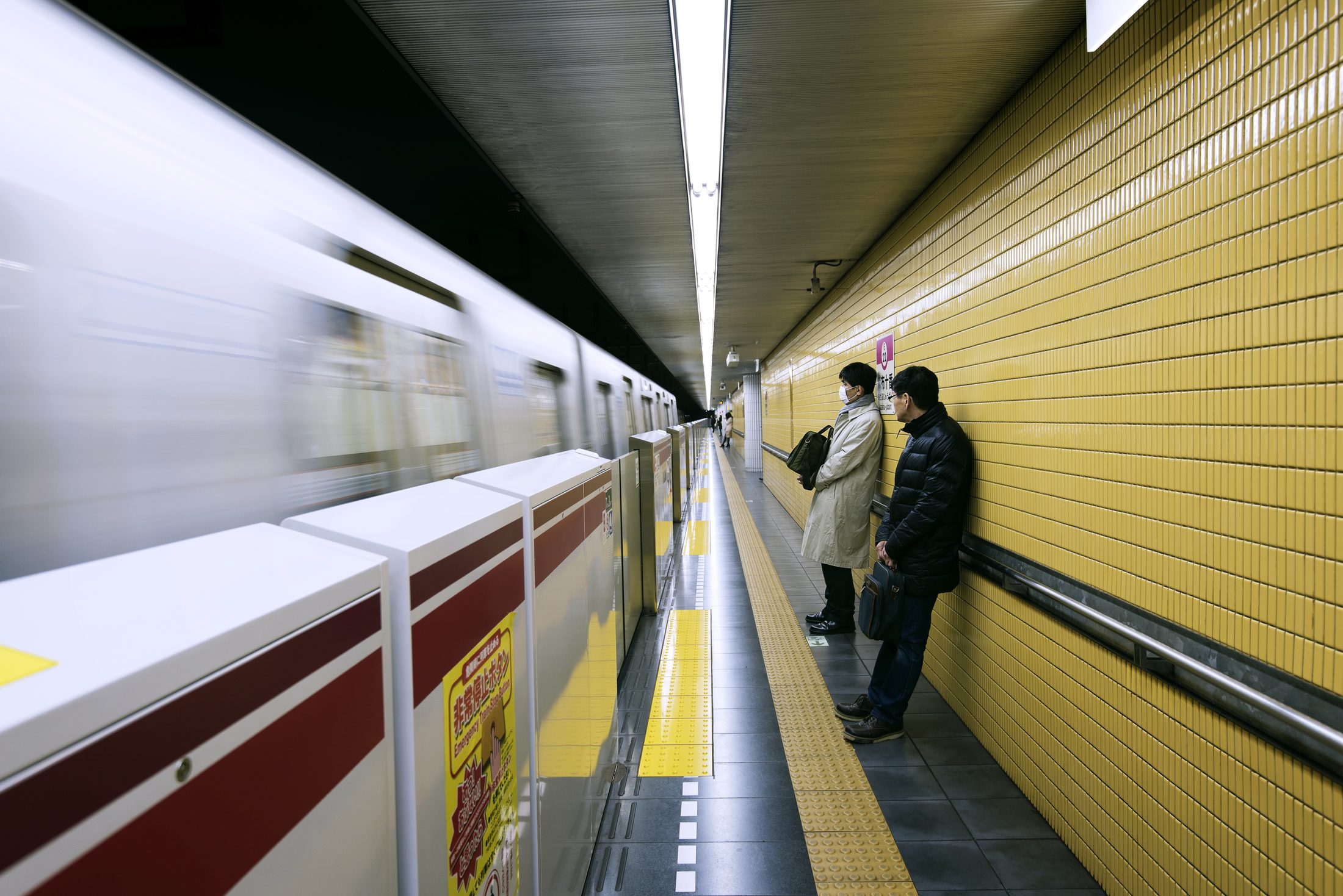 A train passing through a Tokyo subway platform